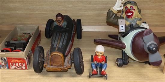 A Machine robot toy, boxed, a tin plate racer, a clown pilot and a similar car